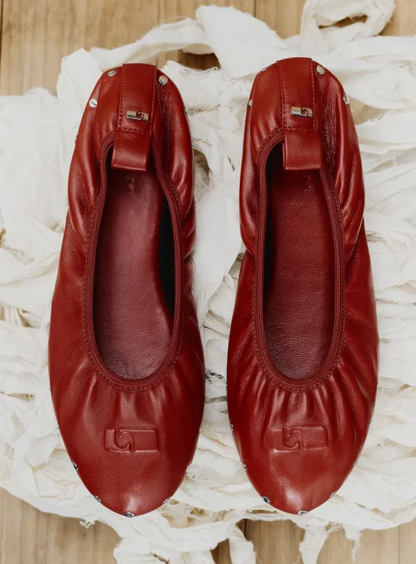 PLIÉ RED STUDS BALLERINA sold by LAAGAM