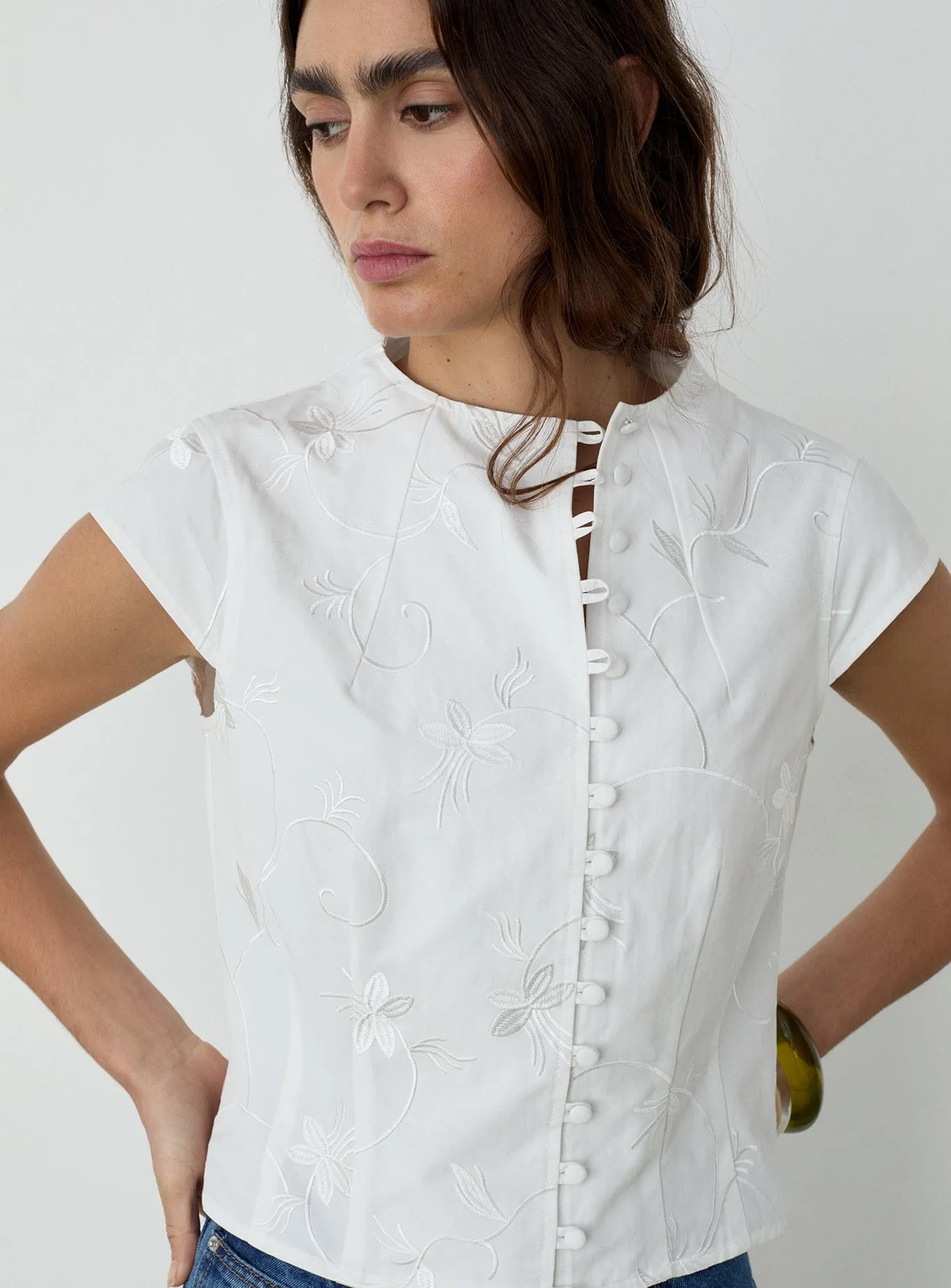 MELANI WHITE ASYMMETRIC BLOUSE sold by LAAGAM