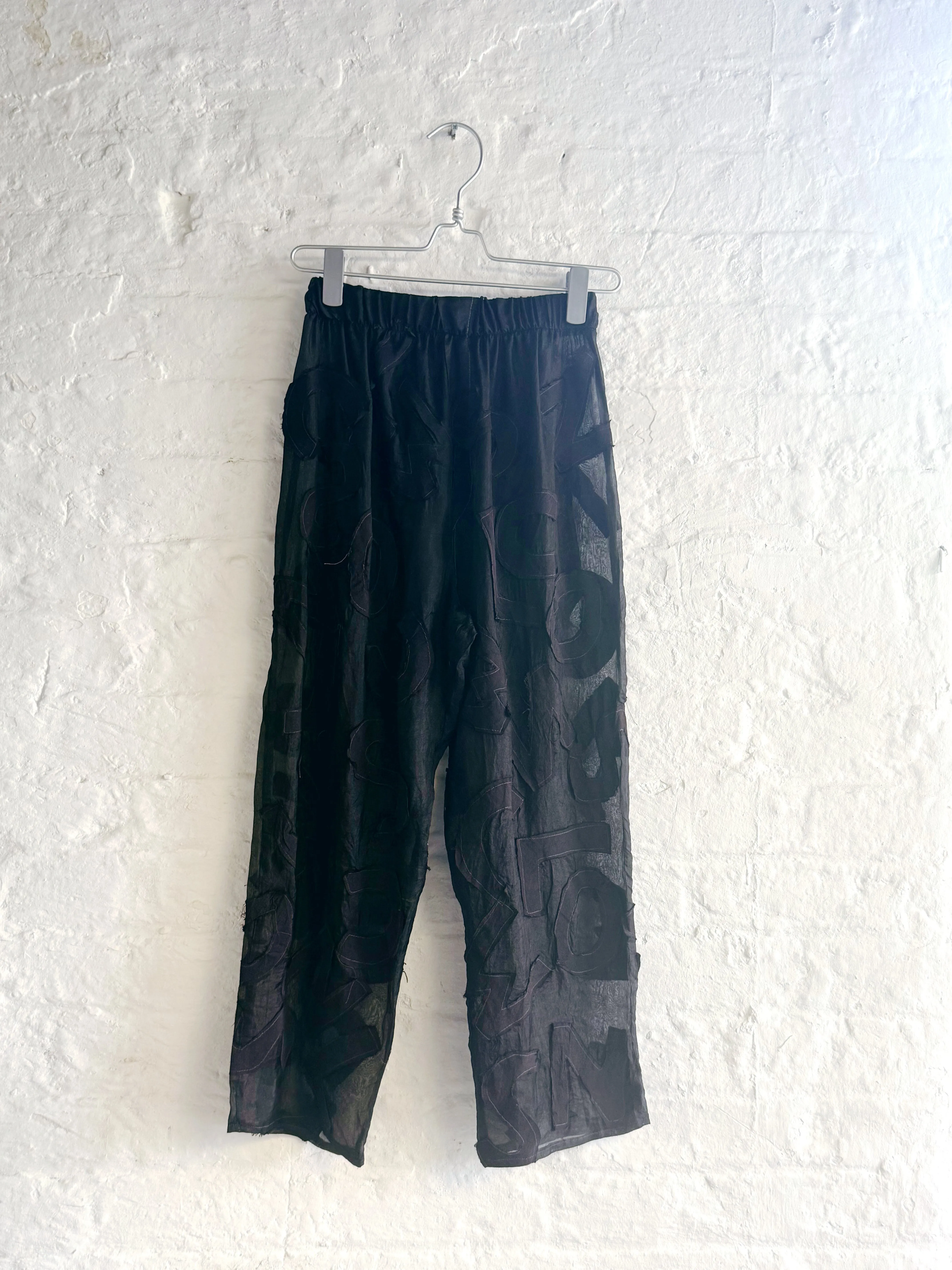 Letters Sheer Trousers sold by Emiko Studios