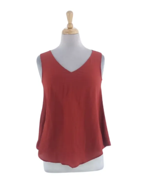 SLEEVELESS SOLID BLOUSE sold by FBO