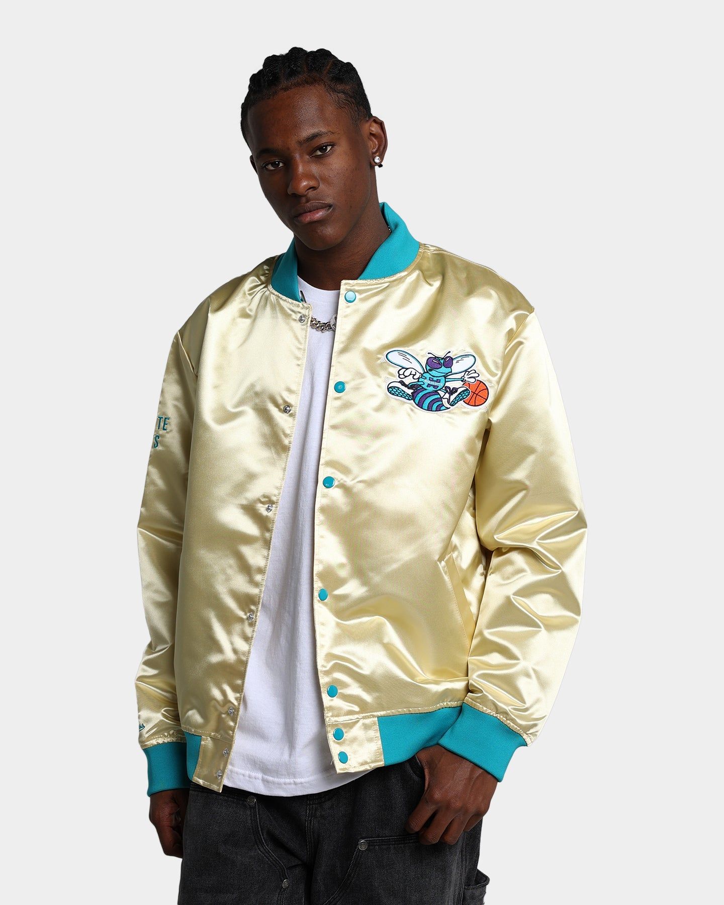 Mitchell & Ness Charlotte Hornets Fashion Lightweight Satin Jacket Light Gold sold by Culture Kings