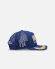 New Era New York Yankees 'Podium Pack' Pre-Curved Golfer Trucker Snapback Light Royal/Metallic Gold sold by Culture Kings