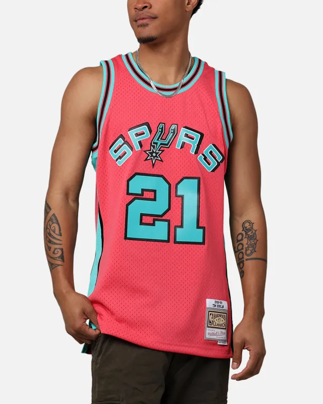 Mitchell & Ness San Antonio Spurs Tim Duncan 'Spurs 2014 Champs' '98-99 Swingman Jersey Pink sold by Culture Kings