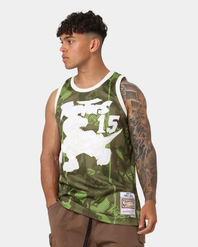 Mitchell & Ness Vince Carter Toronto Raptors '98-'99 Camo Swing Jersey Green Camo sold by Culture Kings