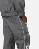 The Anti Order Track Club Nylon Jogger Dark Grey/Grey sold by Culture Kings
