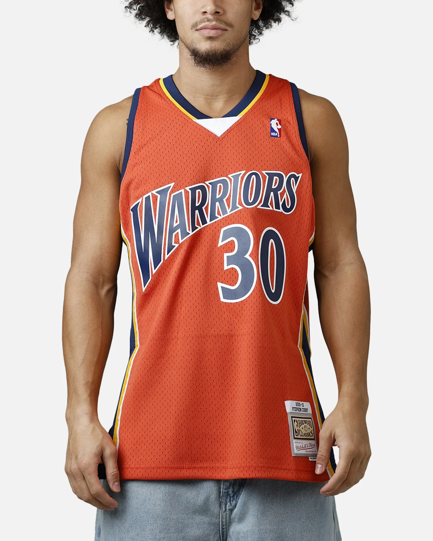 Mitchell & Ness Golden State Warriors Stephen Curry 2010 Swingman Jersey Orange sold by Culture Kings