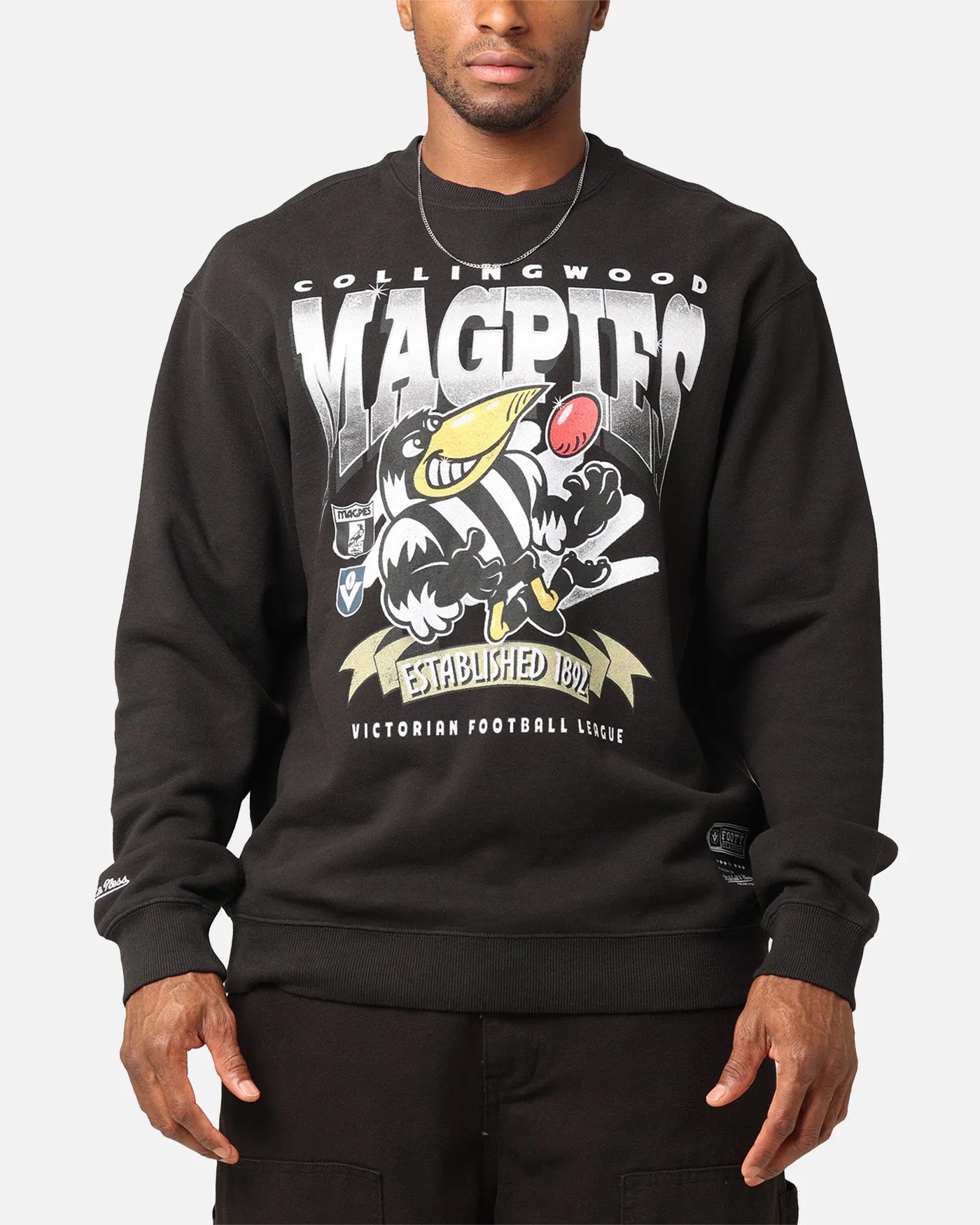 Mitchell & Ness Collingwood Magpies Character Crewneck Faded Black sold by Culture Kings