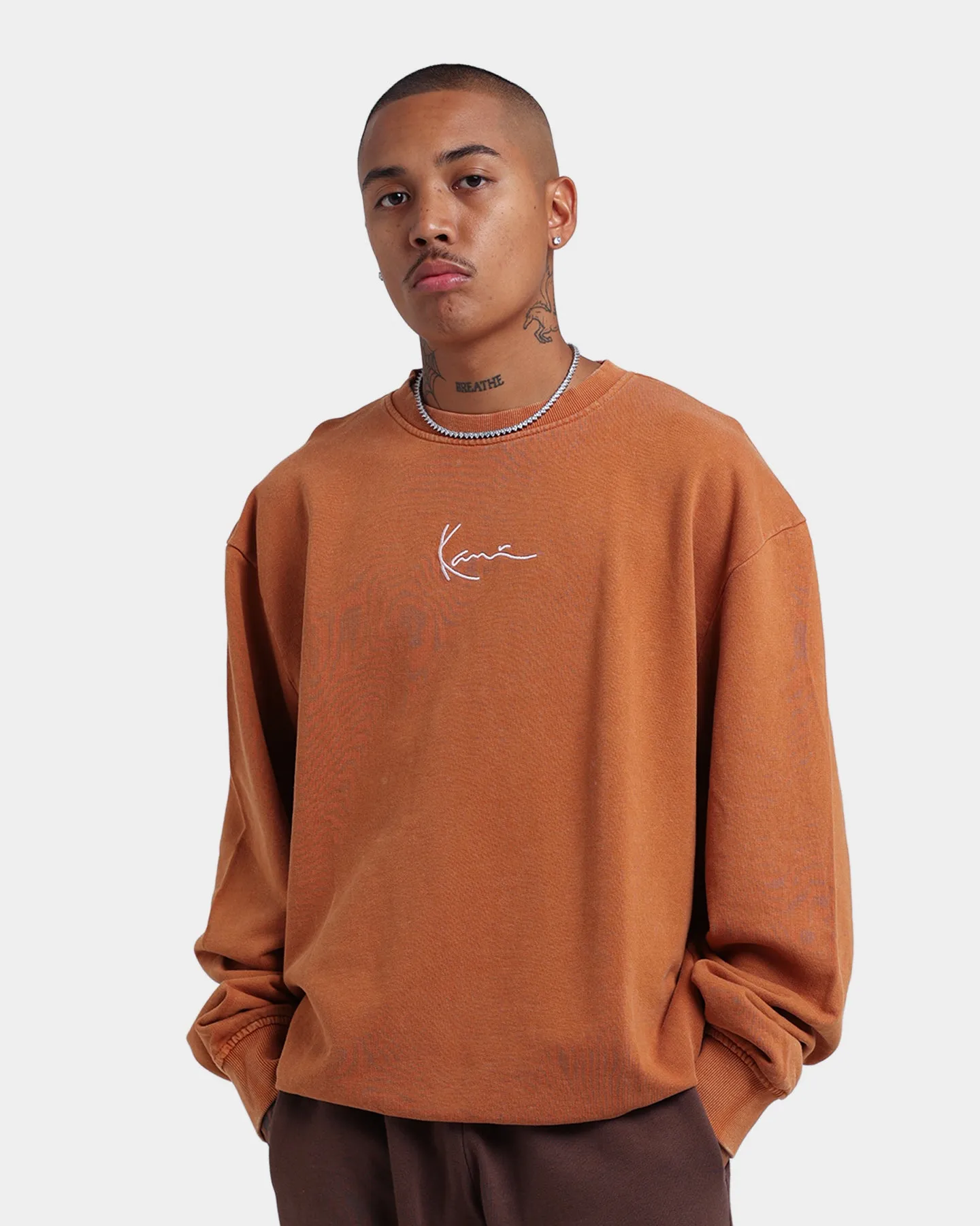 Karl Kani Signature Washed Crewneck Ocher sold by Culture Kings