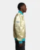 Mitchell & Ness Charlotte Hornets Fashion Lightweight Satin Jacket Light Gold sold by Culture Kings