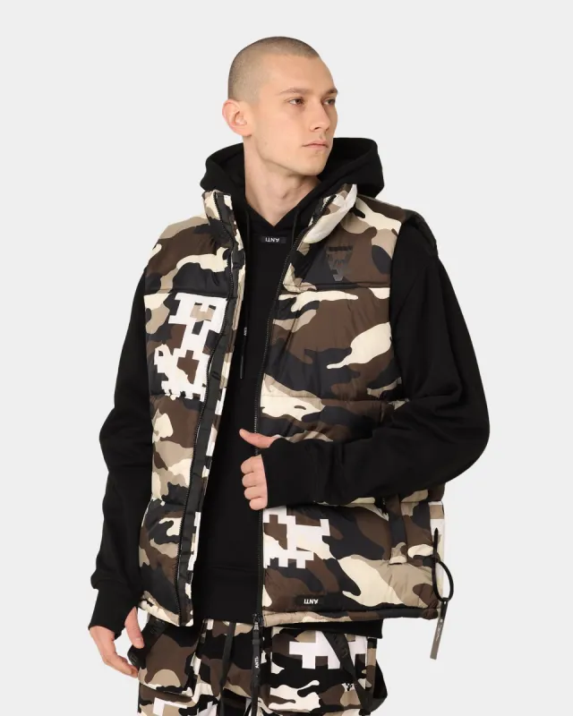 The Anti-Order Dead Pixel Puffer Vest Brown/White/Black Camo sold by Culture Kings