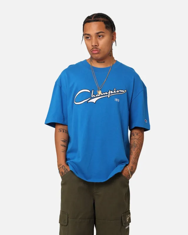 Champion Heritage Cursive Logo T-Shirt Pelican Do sold by Culture Kings