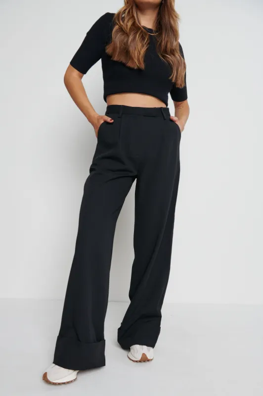 Rae Wide Leg Trousers - Black sold by Pretty Lavish
