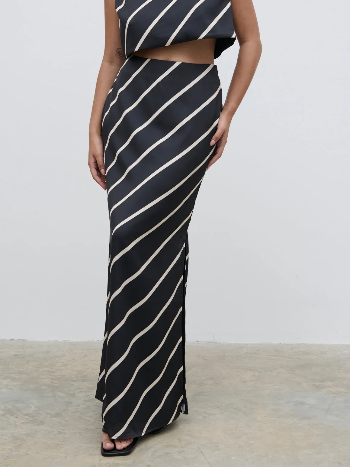 Zuri Maxi Skirt - Black and Cream Asymmetric Stripe sold by Pretty Lavish