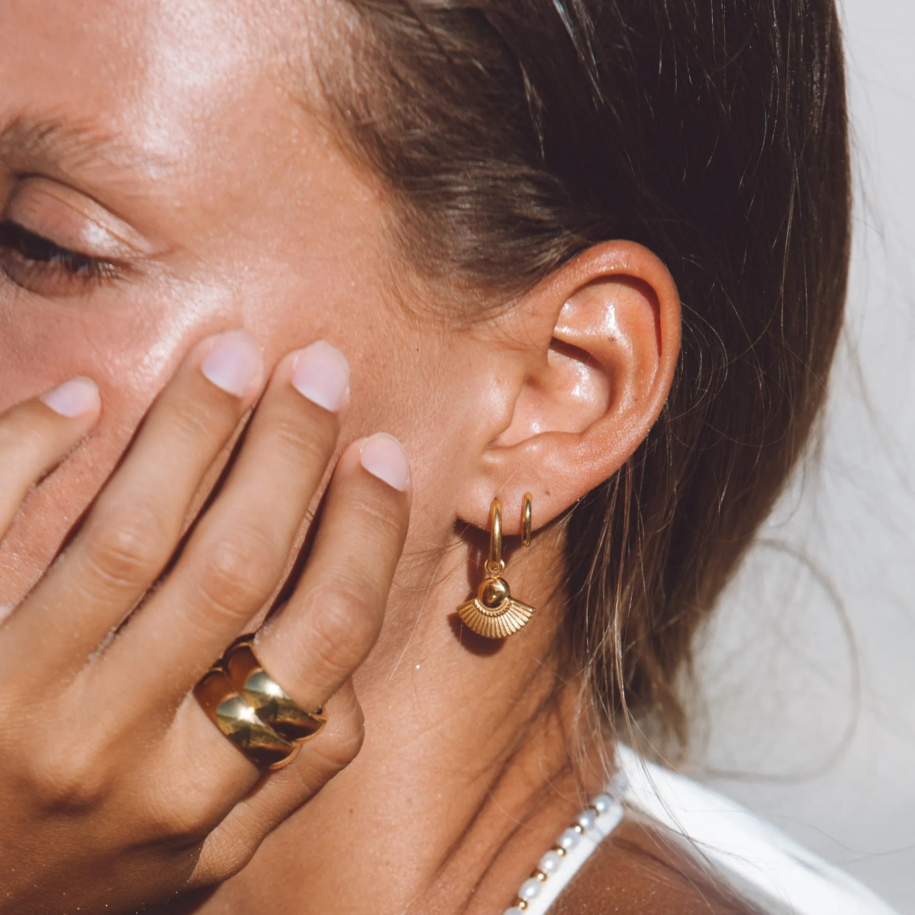 Tiny Huggie Hoops sold by Atolea product image thumbnail 4