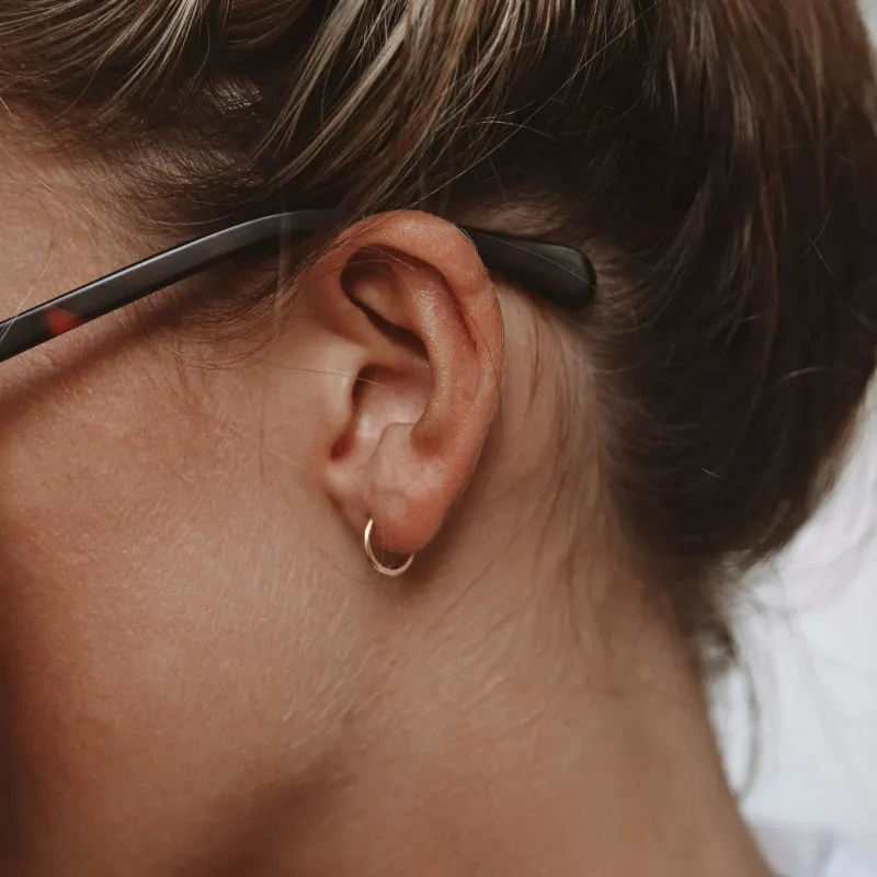 Tiny Huggie Hoops made by Atolea