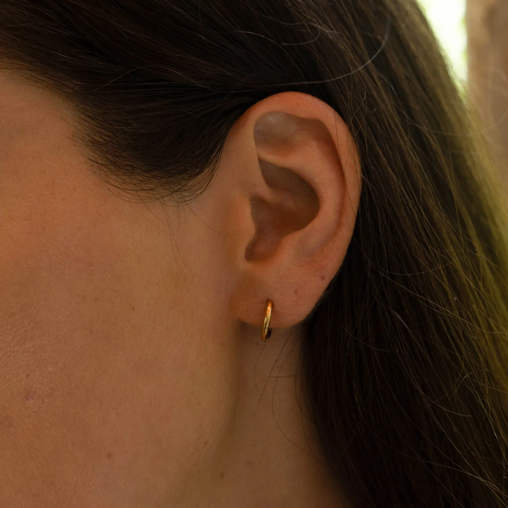 Tiny Huggie Hoops sold by Atolea product image thumbnail 3