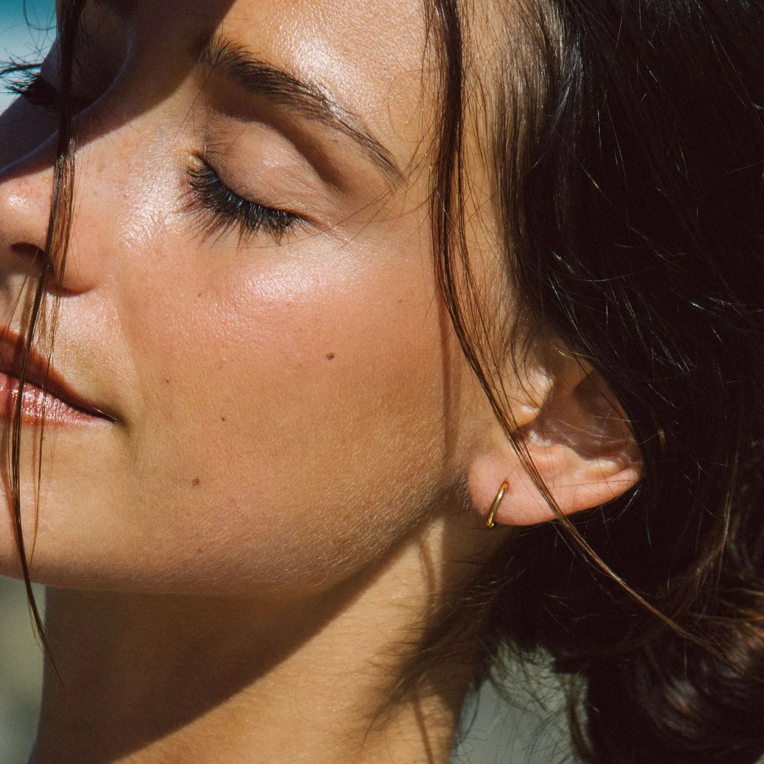 Tiny Huggie Hoops sold by Atolea product image thumbnail 2