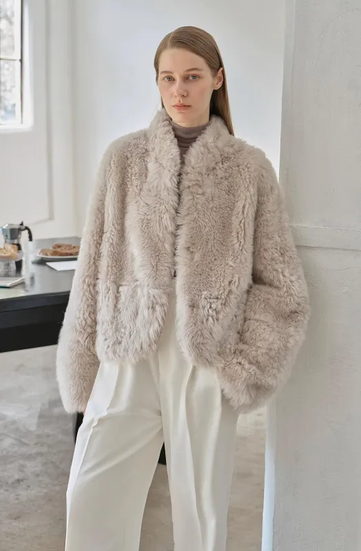 "Yorta" imported Tuscan curly wool upper arc collar sheepskin coat sold by Firelady Fur