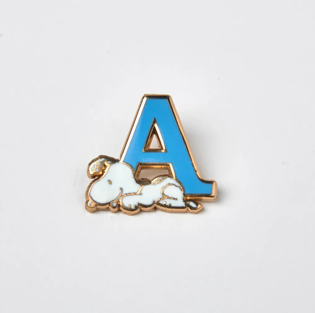 PEANUTS A ALPHABET ENAMEL PIN sold by TSPTR