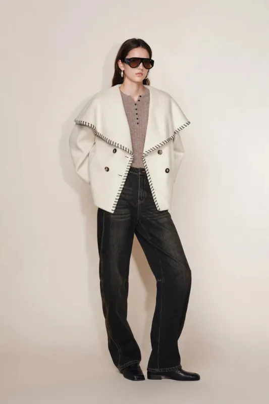 Lumi Handworked Faux Leather Hem Cape Coat in Silk Wool Double Face sold by Fabrique