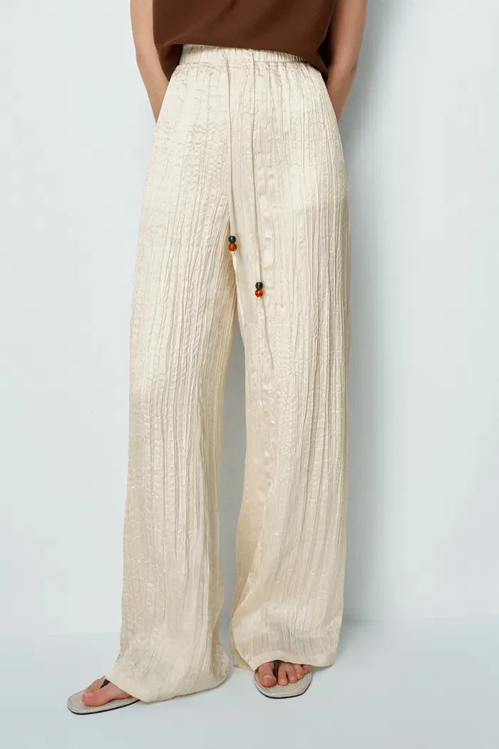 Aurora Textured Pants in Pleated Satin sold by Fabrique