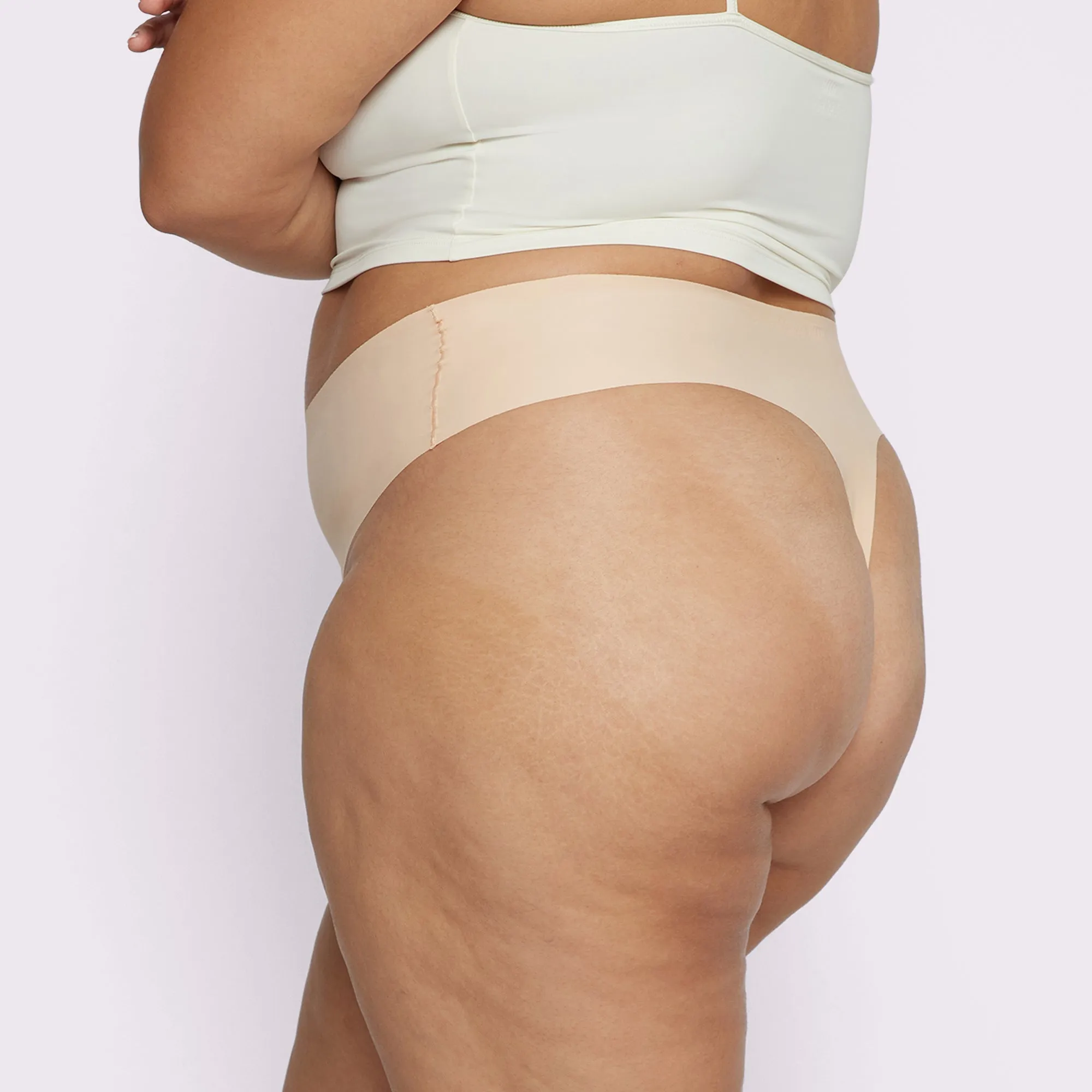 Invisible High Rise Thong | Seamless Universal (Sand) sold by Parade