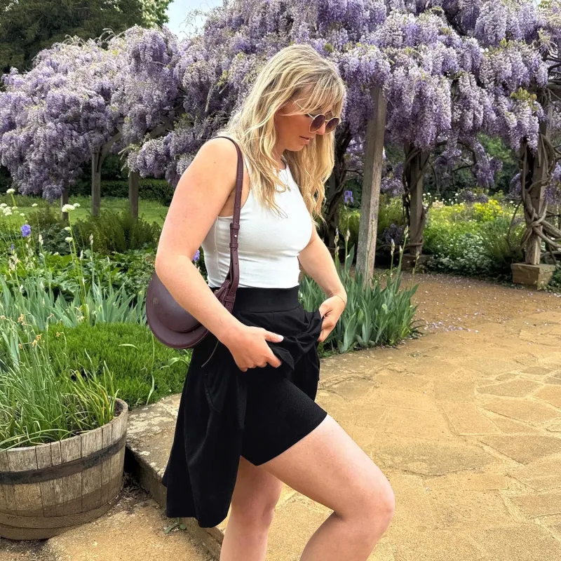 Petal Pleated Skort - Black sold by Snag Tights