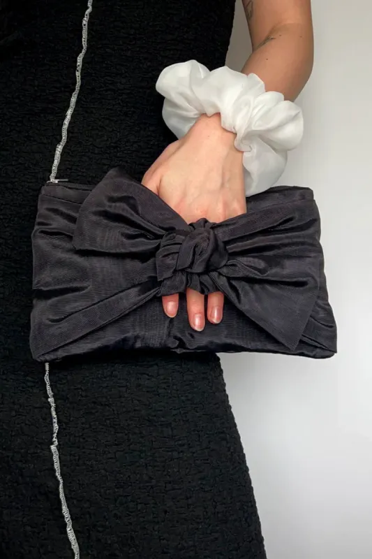 Bow Clutch sold by Hills Dry Goods