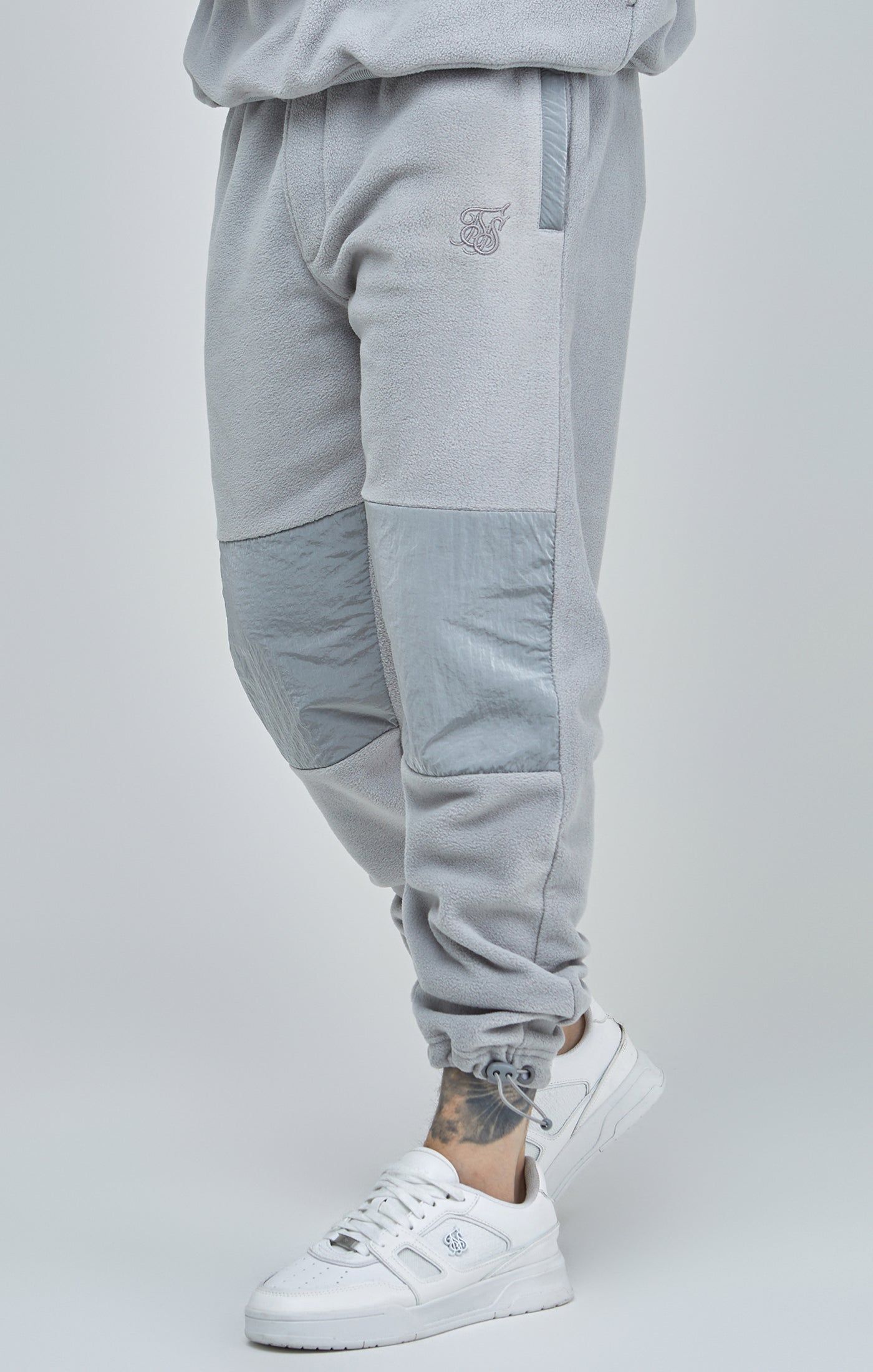 Grey Polar Fleece Panelled Cuffed Jogger sold by Siksilk