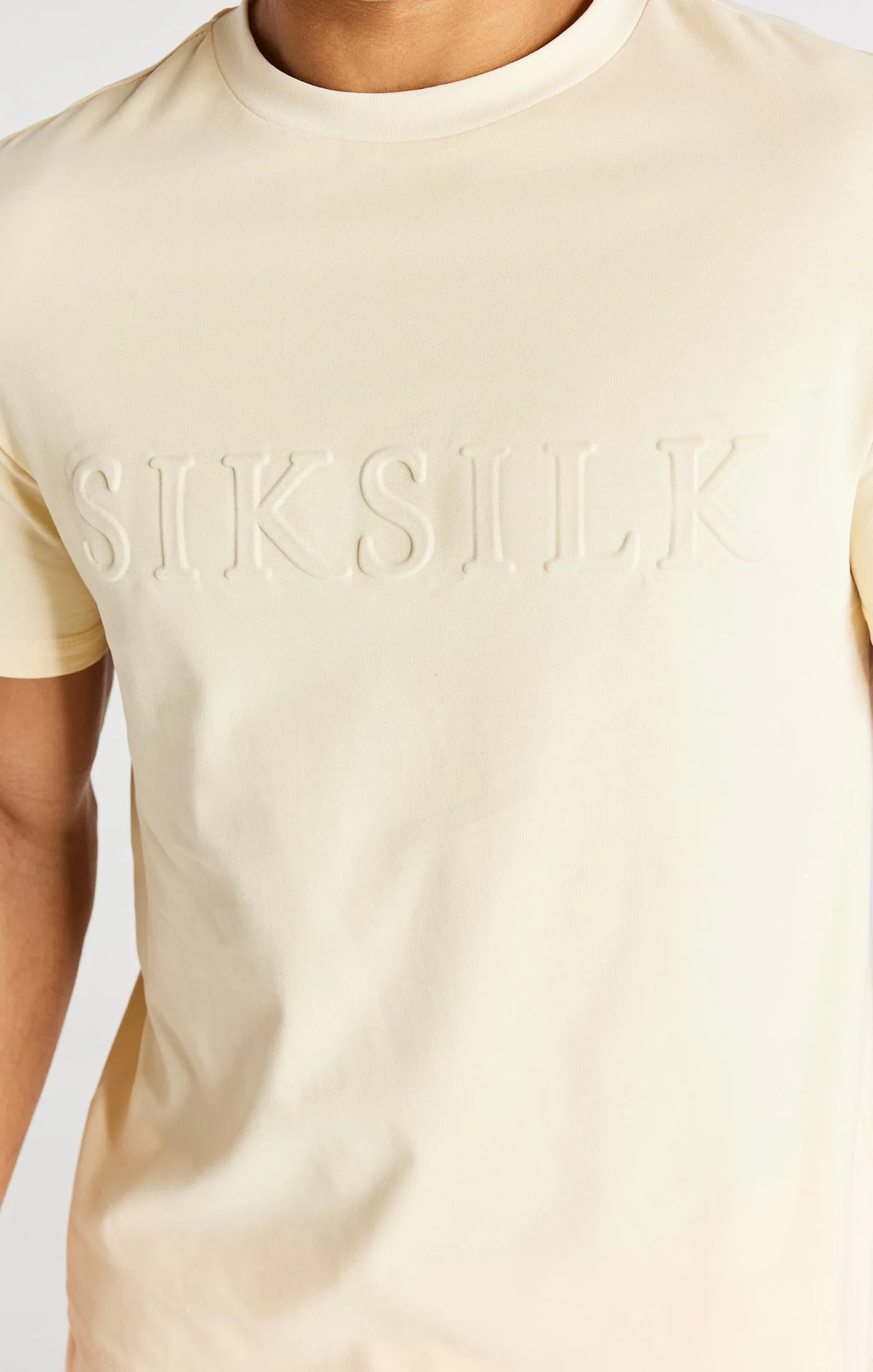 Ecru Embossed Relaxed Fit T-Shirt sold by Siksilk