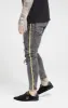 Grey Distressed Taped Skinny Denim sold by Siksilk
