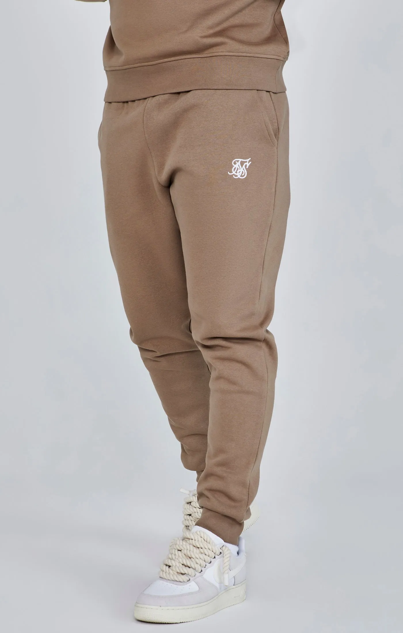 Brown Essentials Joggers sold by Siksilk