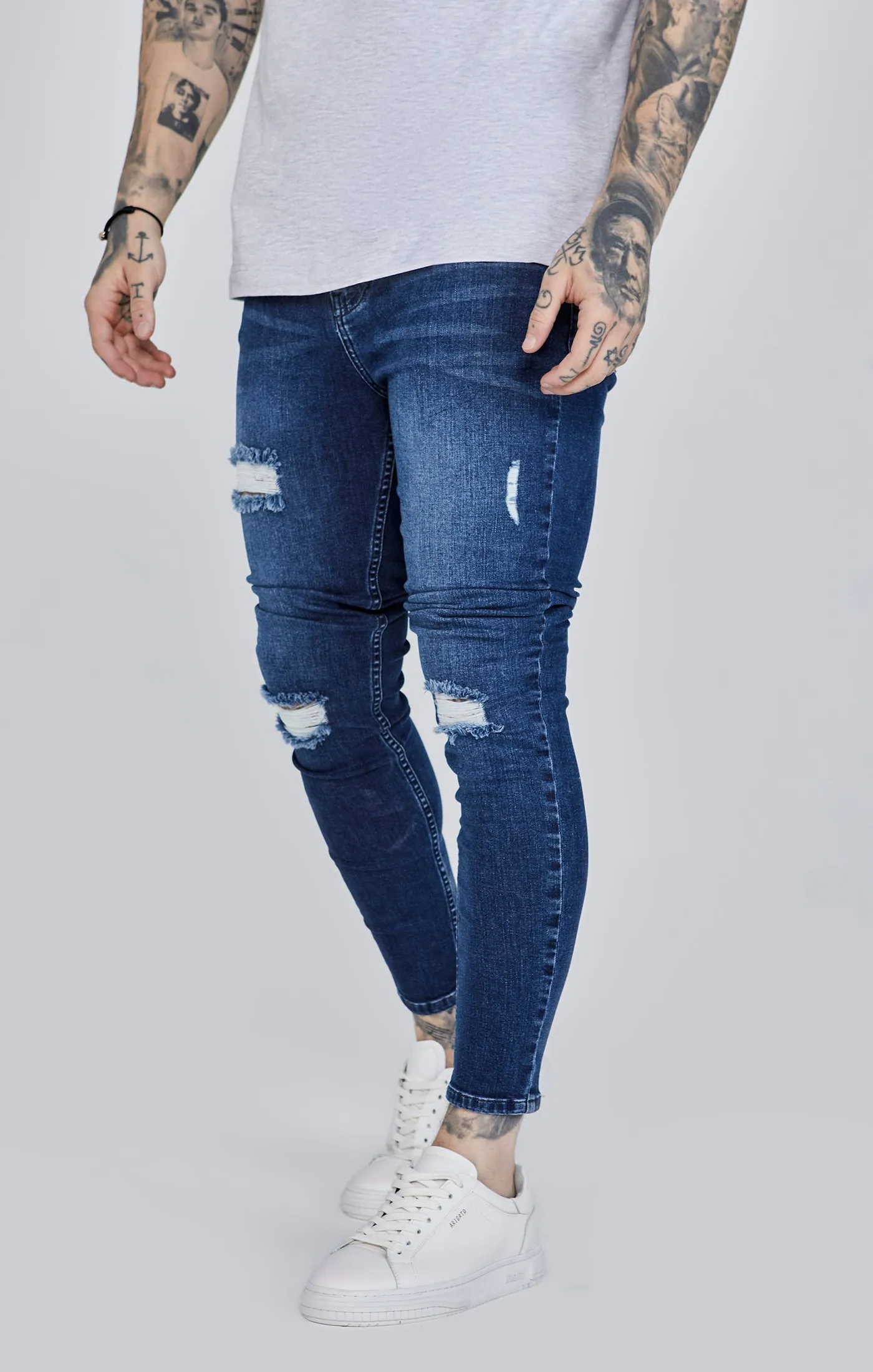 Blue Distressed Skinny Jeans sold by Siksilk