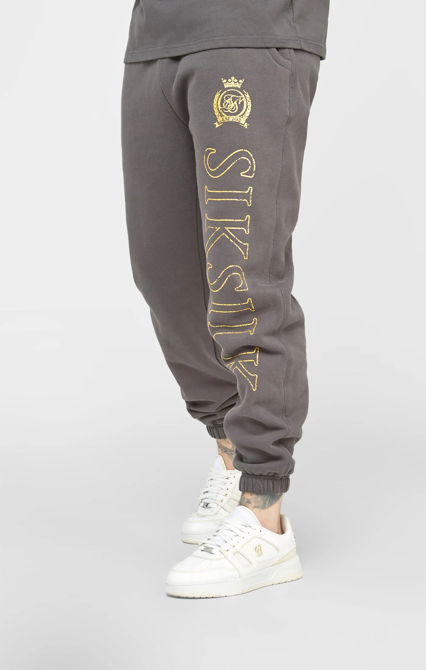 Black & Gold Relaxed Jogger sold by Siksilk