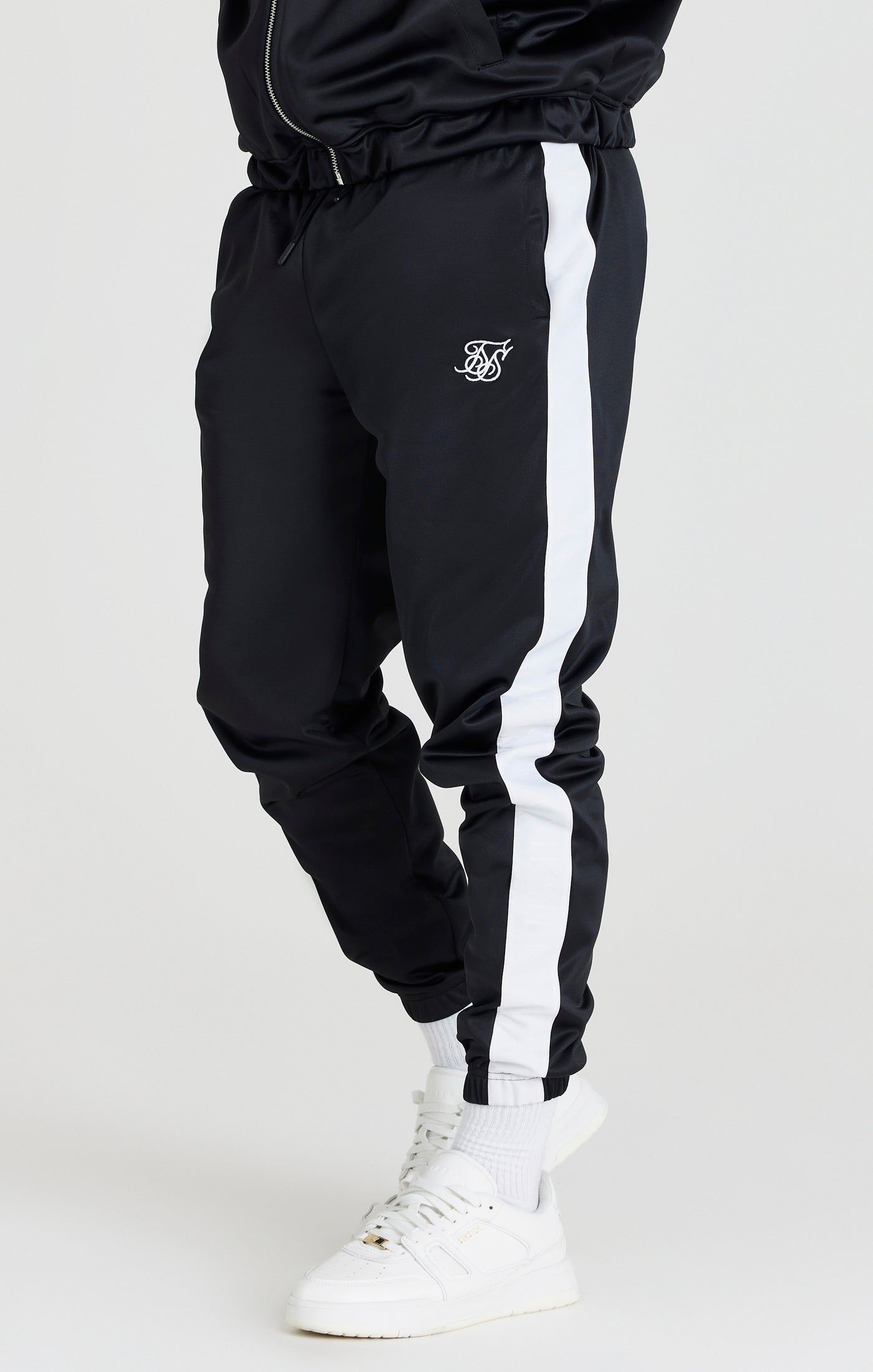 Black Tape Thru Track Pant sold by Siksilk