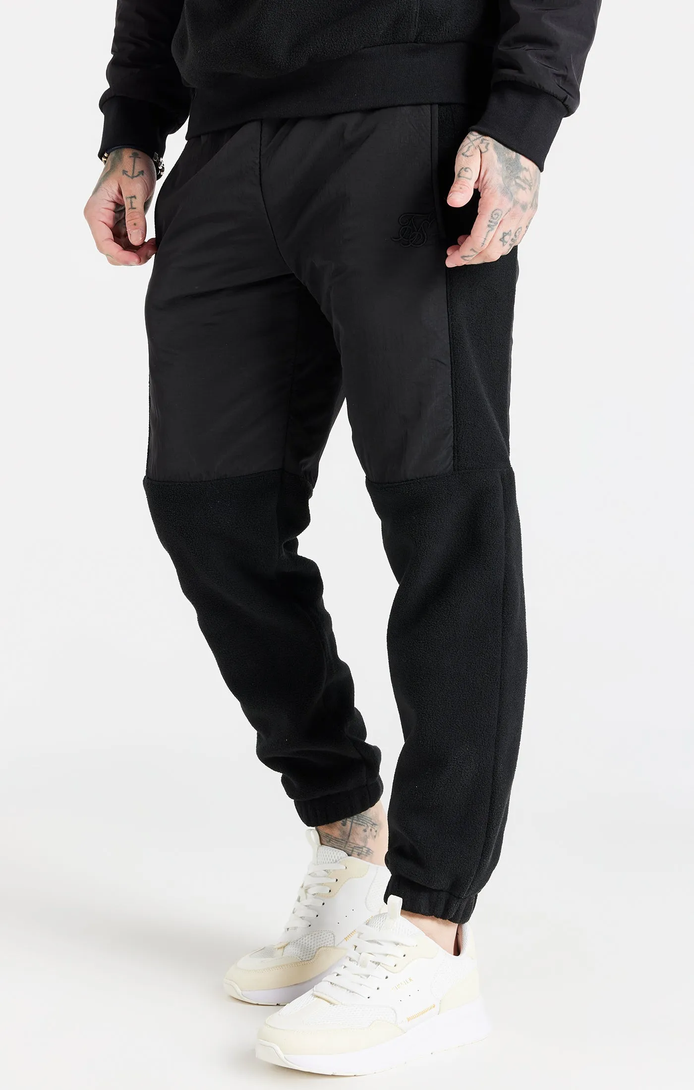 Black Hybrid Pro Cuff Pant sold by Siksilk