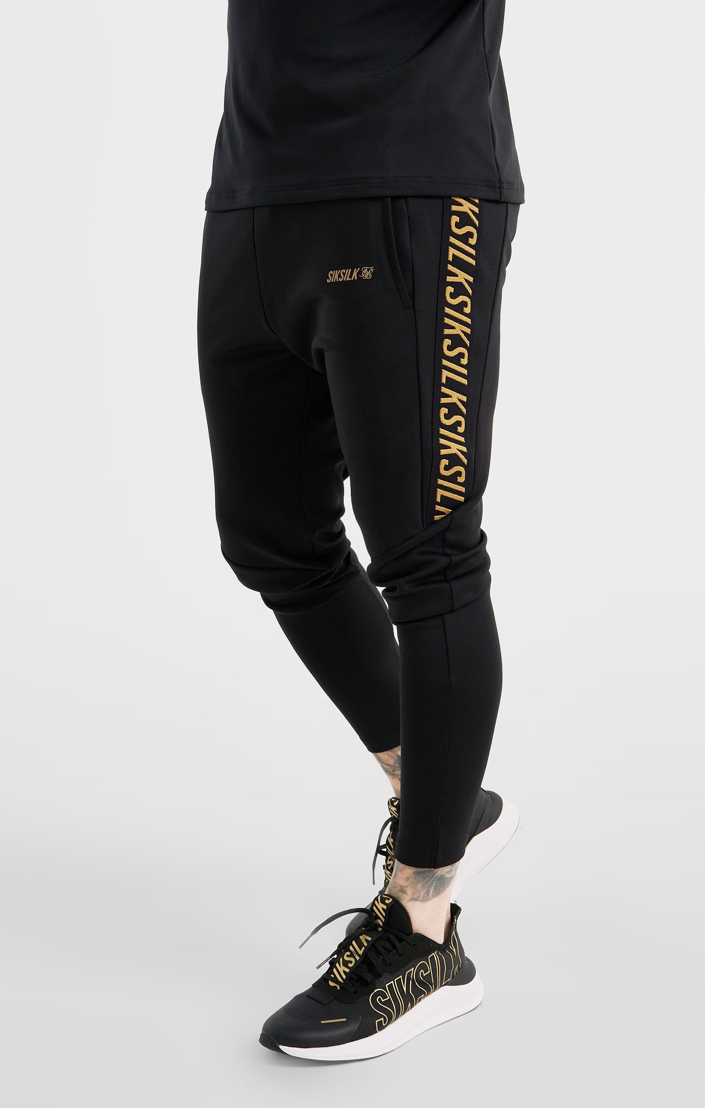 Black Sports Taped Muscle Fit Track Pant sold by Siksilk