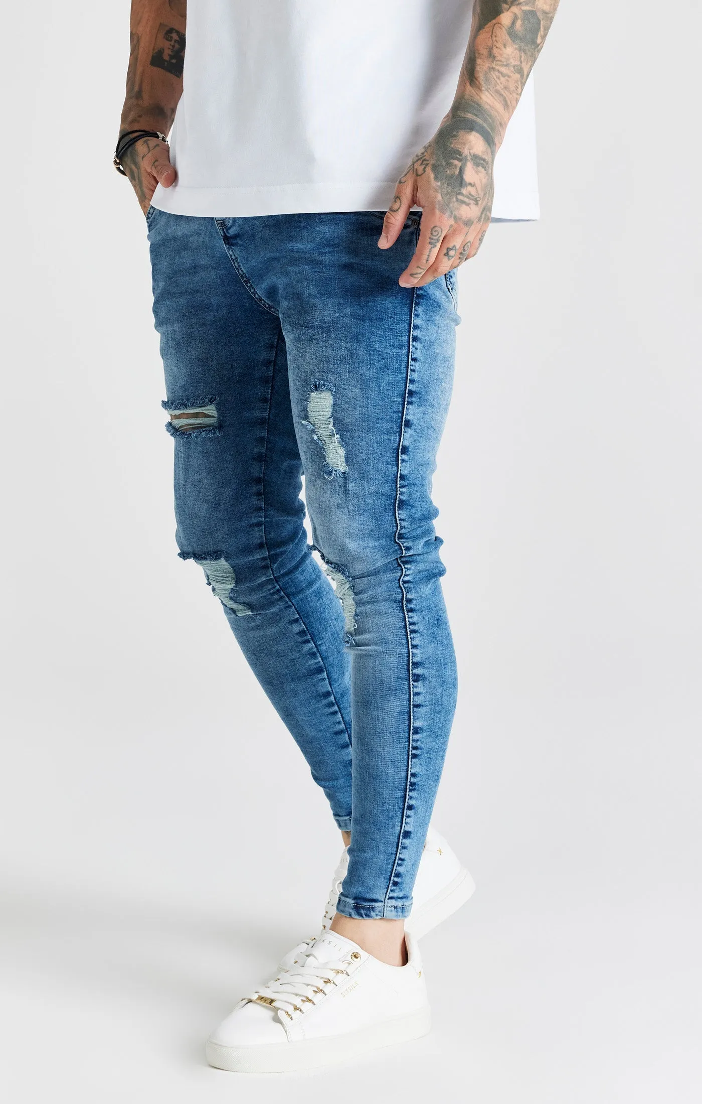 Blue Mid Wash Essential Distressed Skinny Jean sold by Siksilk