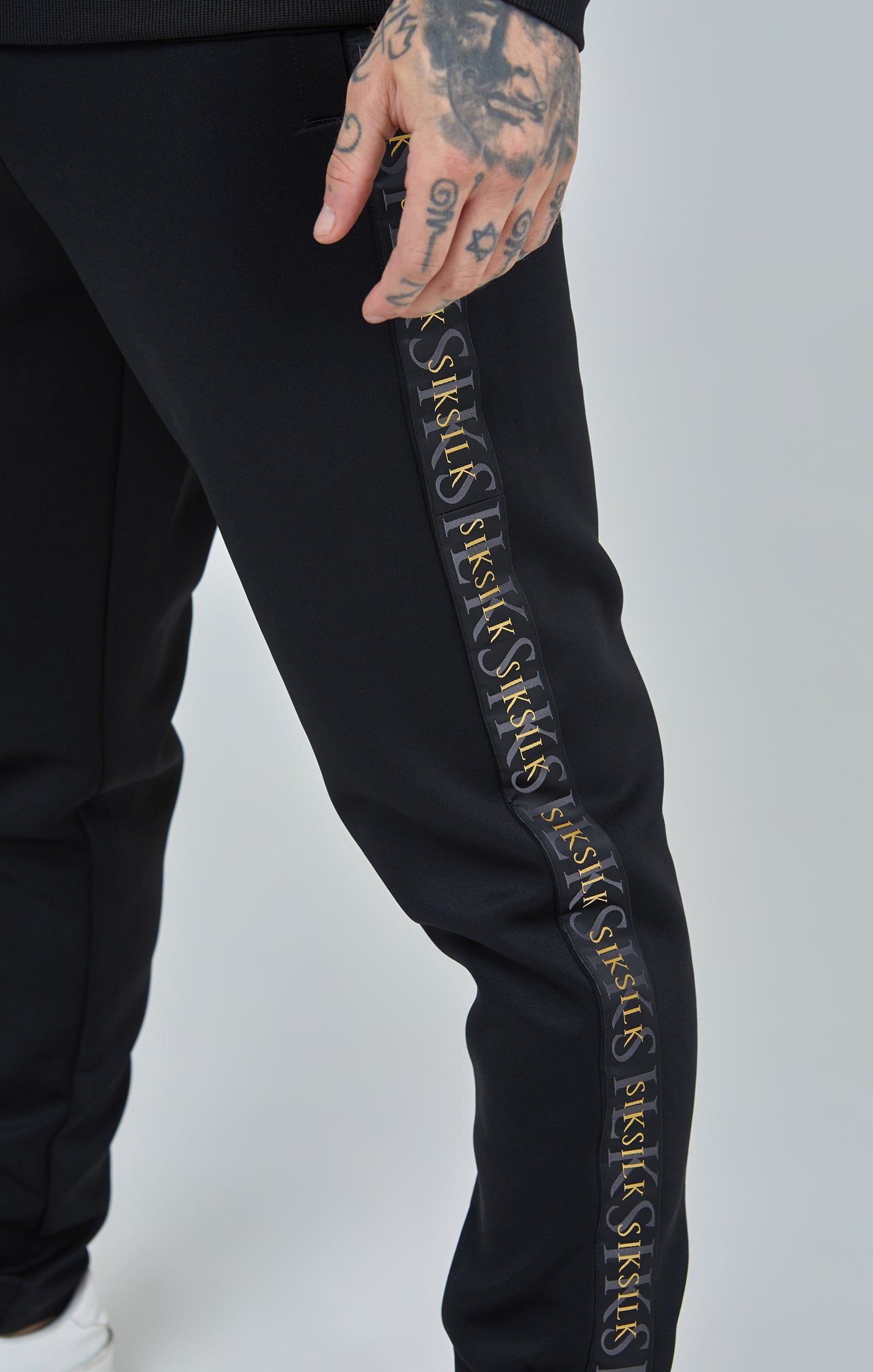 Black Gold Tape Track Pants sold by Siksilk product image thumbnail 6