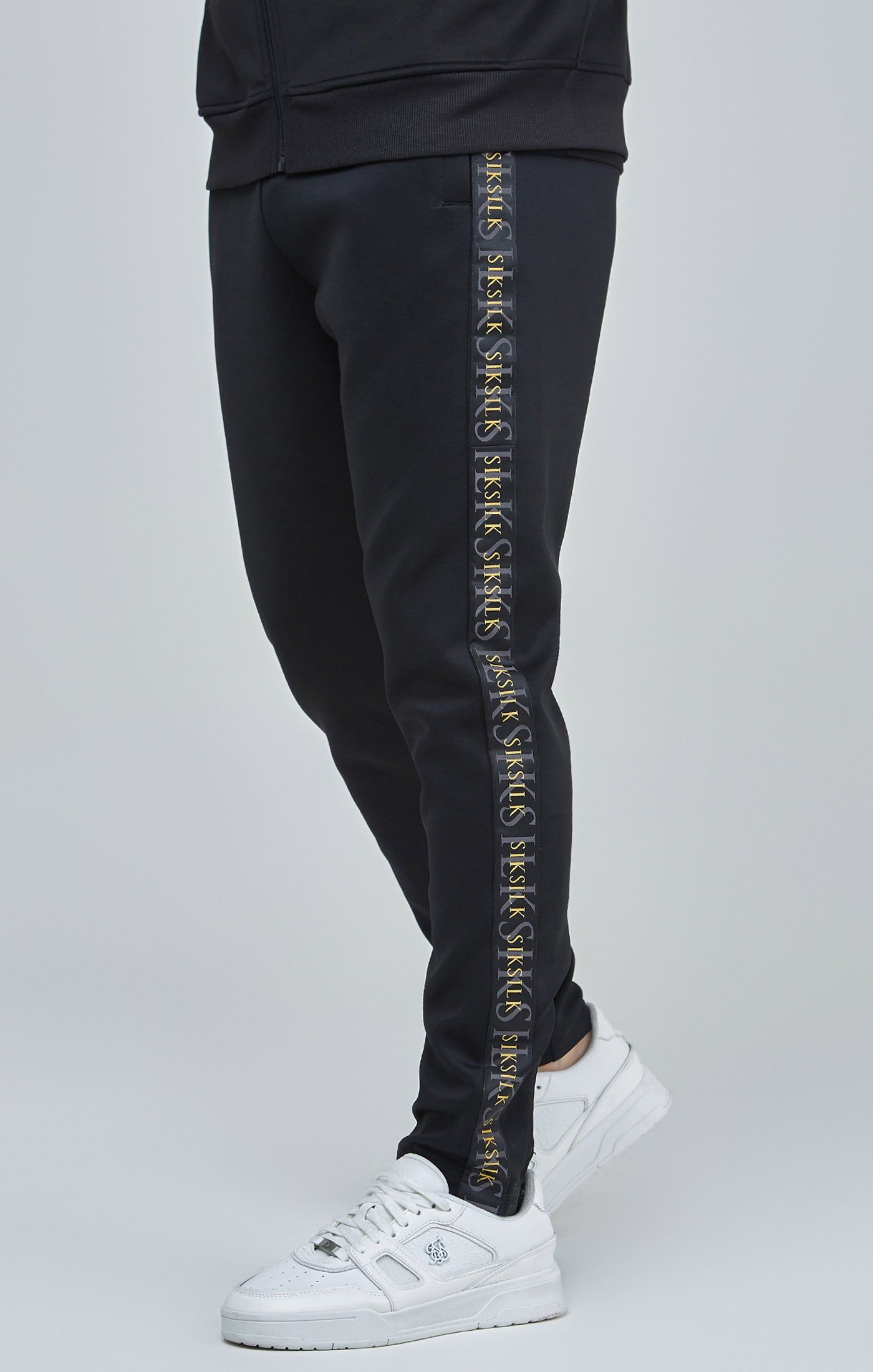 Black Gold Tape Track Pants sold by Siksilk