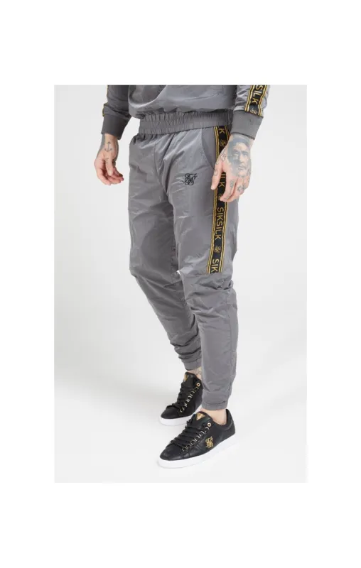 SikSilk Crushed Nylon Taped Joggers – Grey & Gold sold by Siksilk