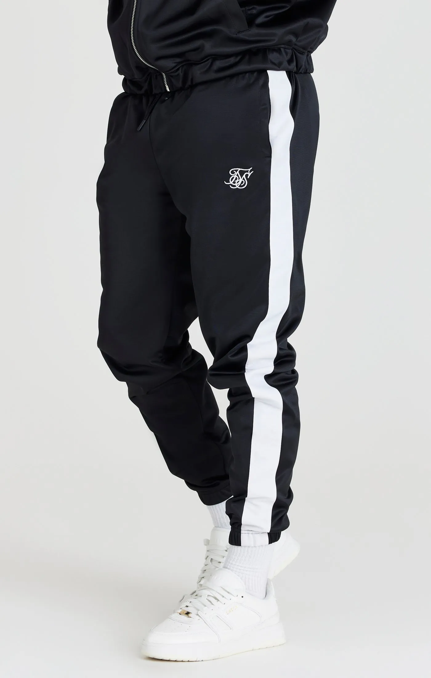 Black Tape Thru Track Pant sold by Siksilk