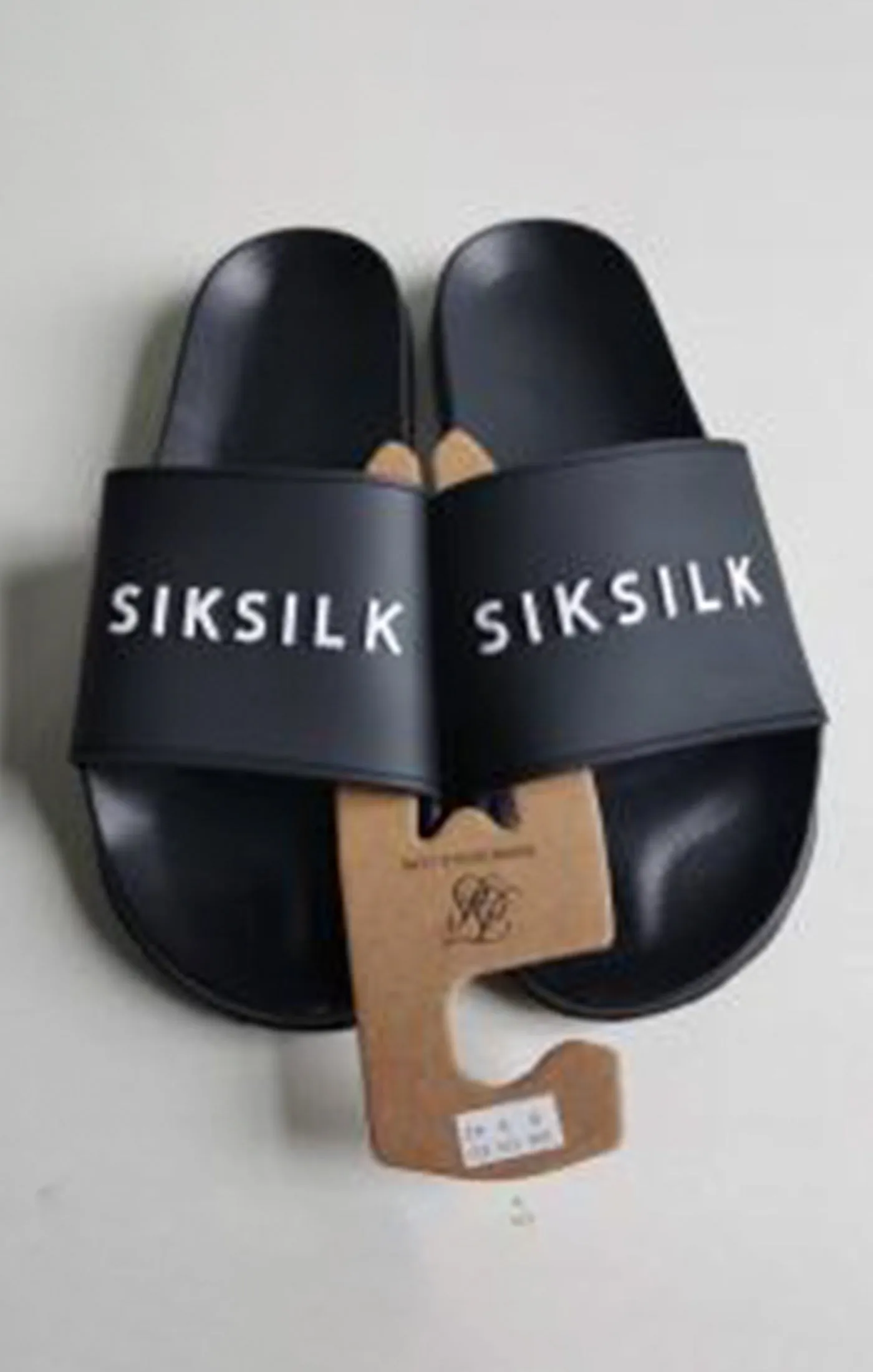Black Raised Branded Slider sold by Siksilk