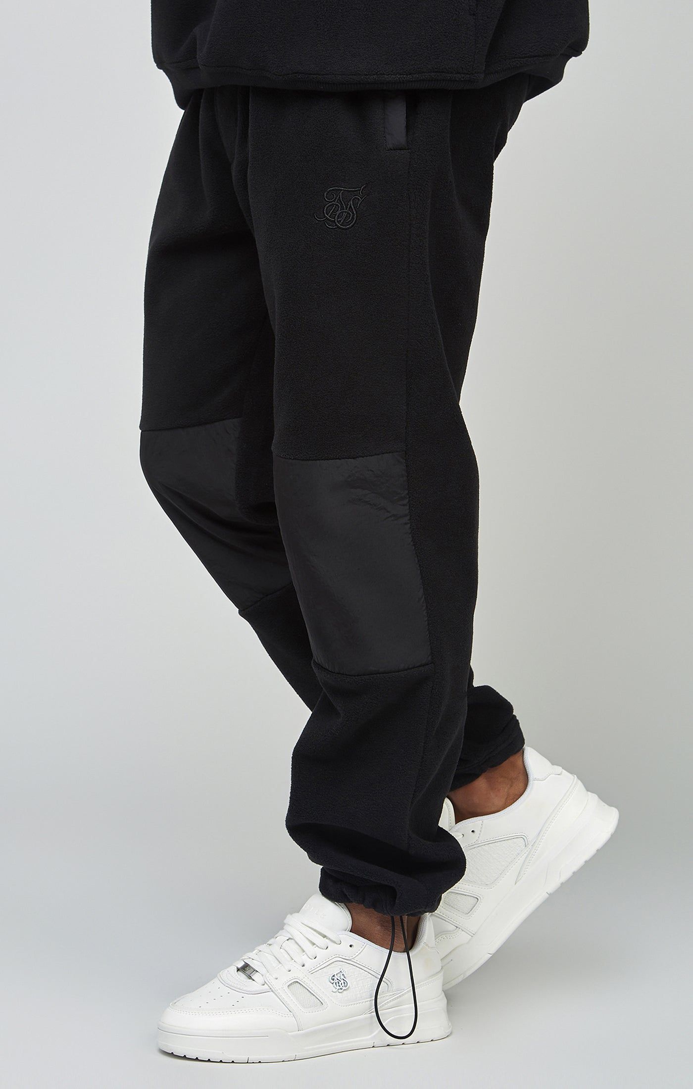 Ecru Polar Fleece Panelled Cuffed Jogger sold by Siksilk