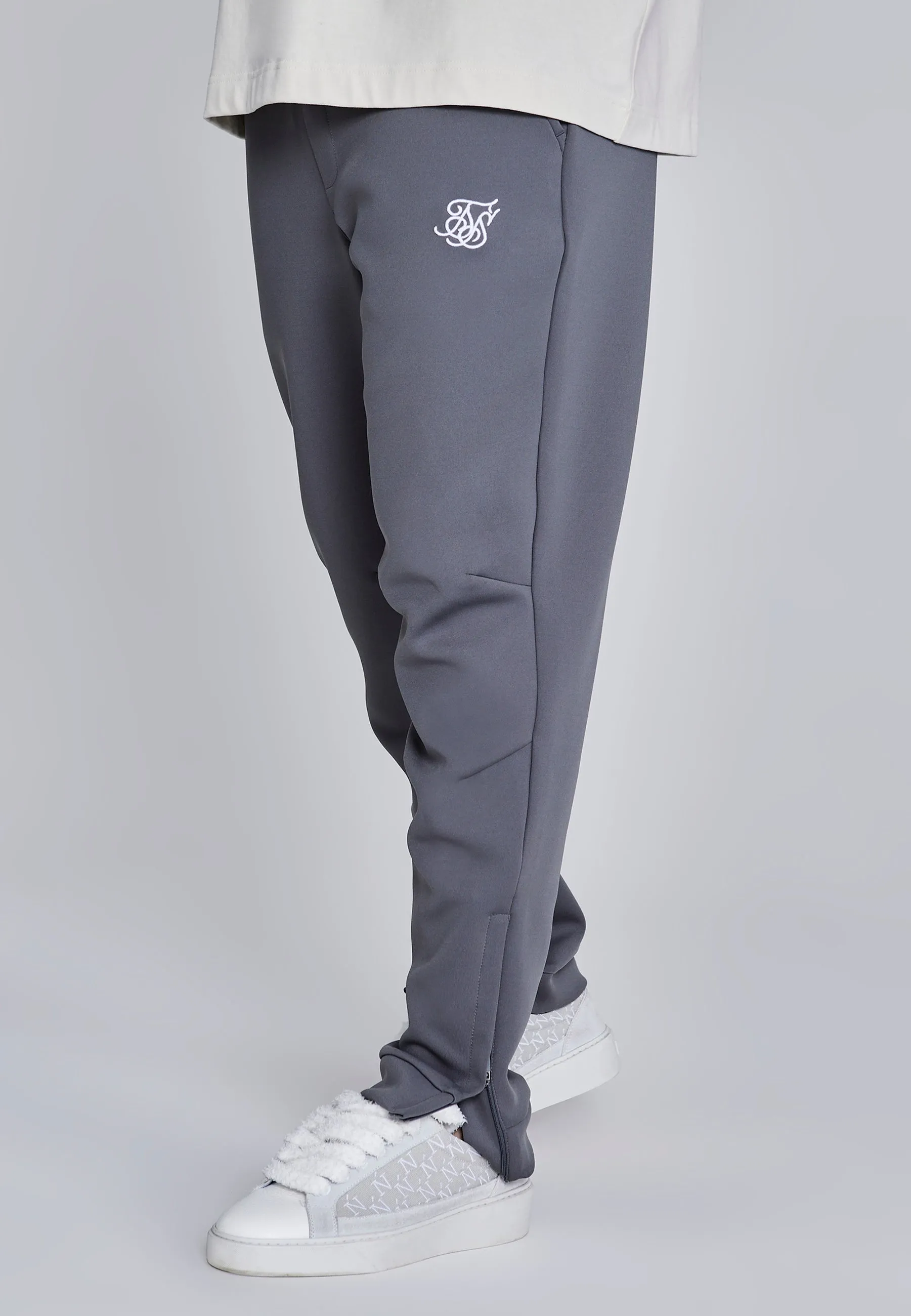 Dark Grey Essentials Poly Joggers sold by Siksilk
