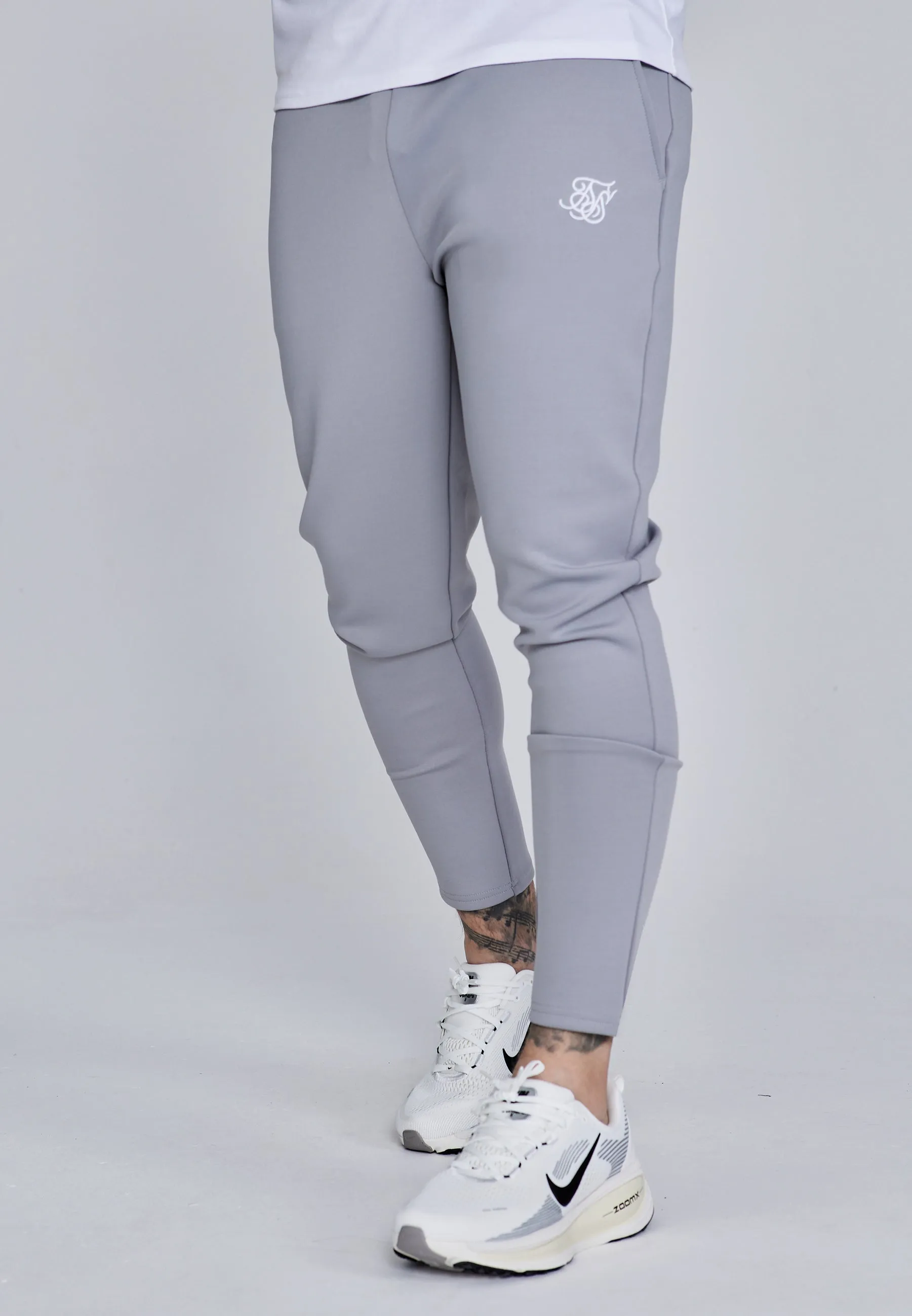 Grey Essentials Poly Joggers sold by Siksilk