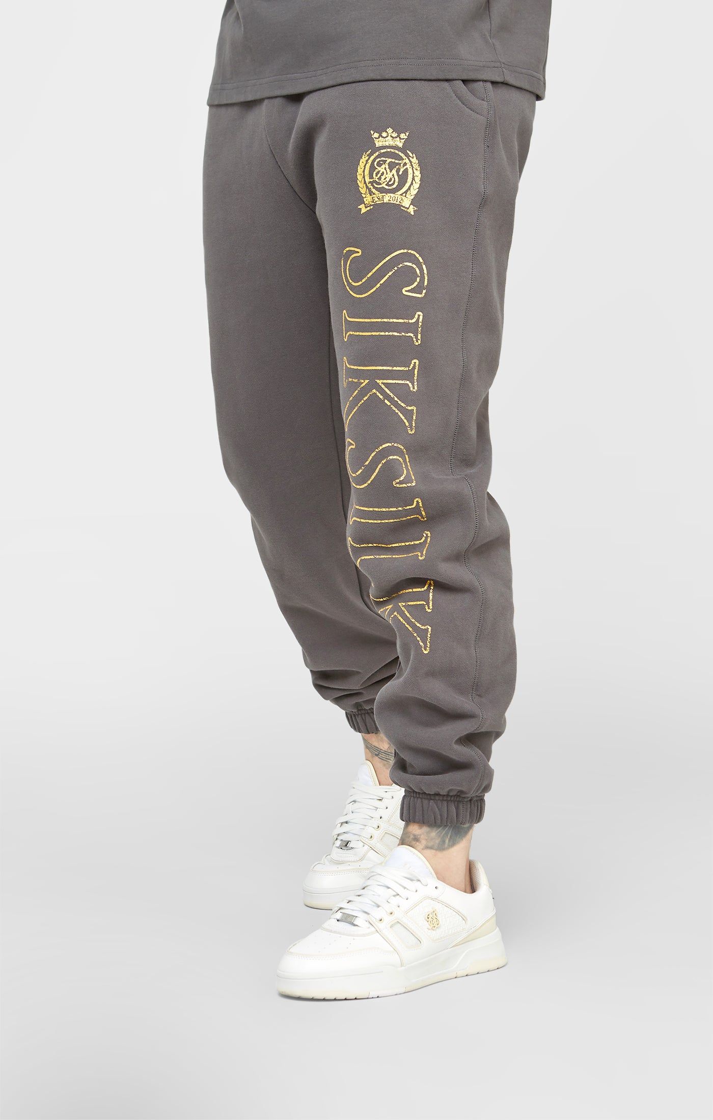 Black & Gold Relaxed Jogger sold by Siksilk