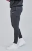 Grey Essentials Poly Joggers sold by Siksilk