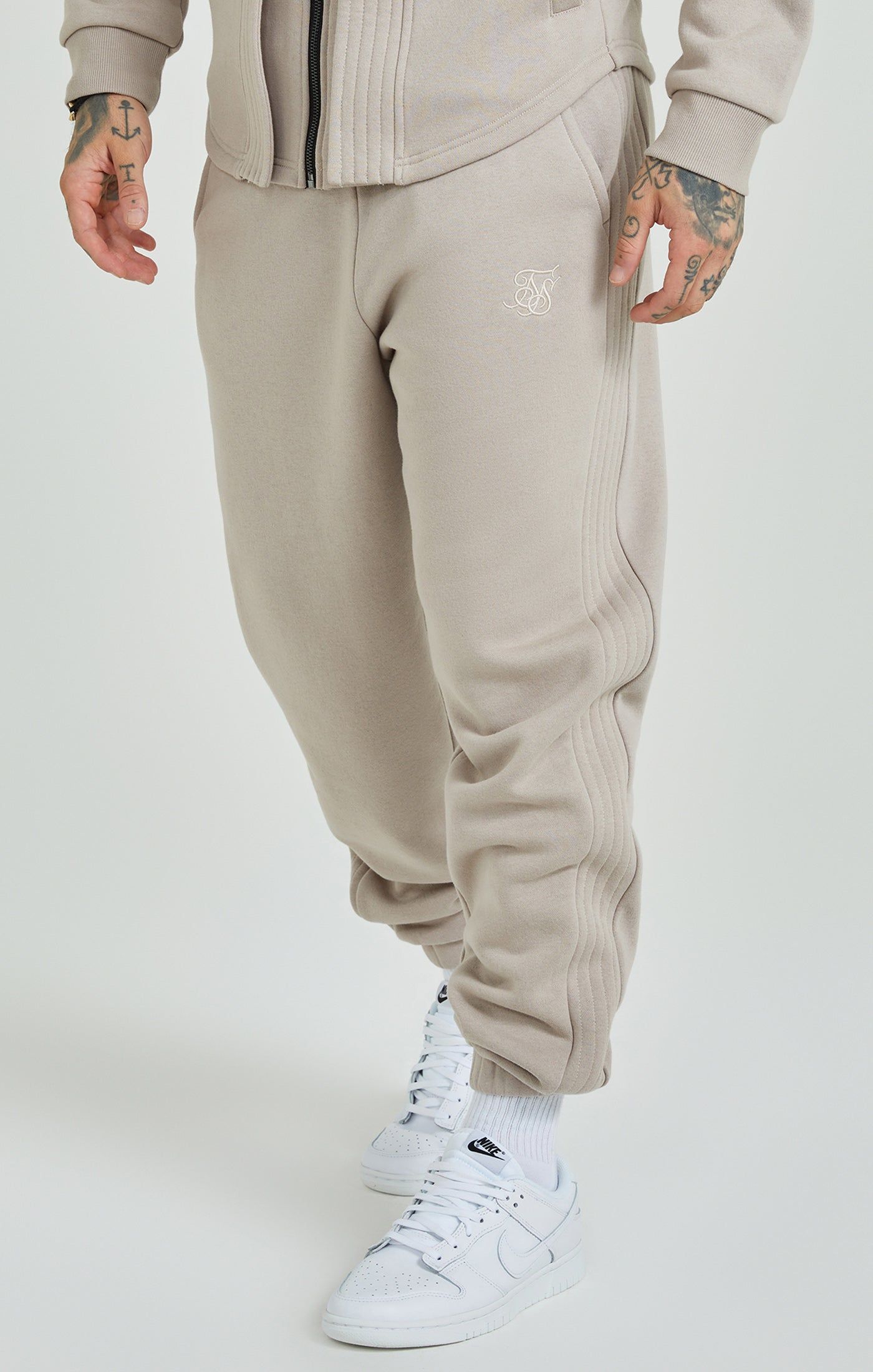 Beige Panelled Relaxed Fit Joggers sold by Siksilk