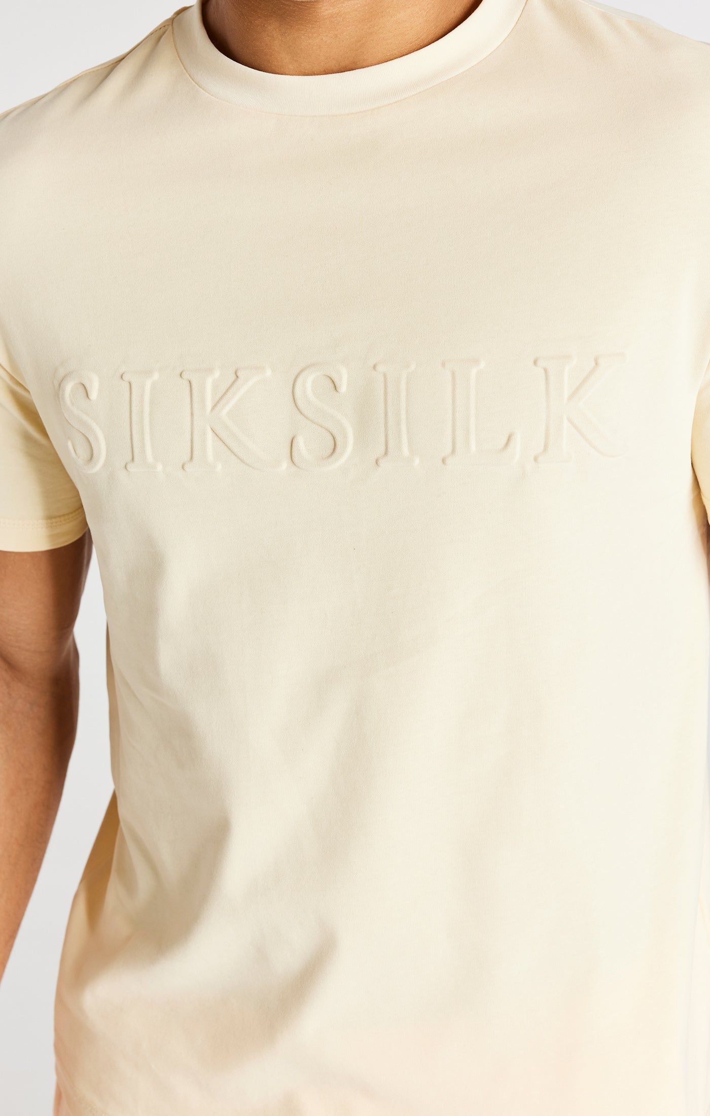 Ecru Embossed Relaxed Fit T-Shirt sold by Siksilk